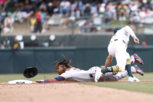 SACRAMENTO, CALIFORNIA - MAY 3: Jacob Wilson #5 of the Athletics catches Jose Ramirez #11 of the Cleveland Guardians trying to steal second base during the fifth inning at Sutter Health Park on May 3, 2026 in Sacramento, California.