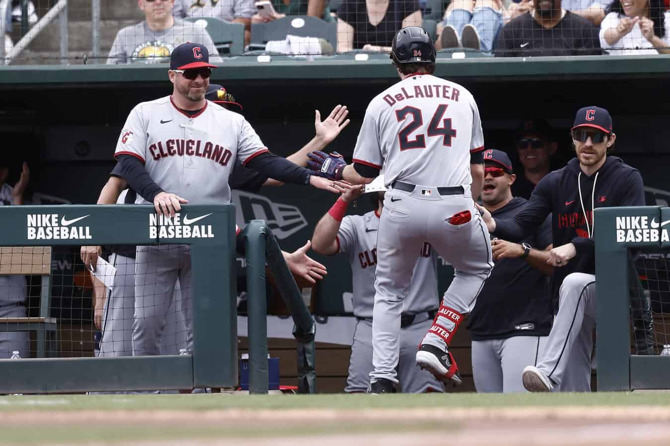 SACRAMENTO, CALIFORNIA - MAY 3: Manager Stephen Vogt #12 of the Cleveland Guardians high fives Chase DeLauter #24 after DeLauter hit a solo home run against the Athletics during the fifth inning at Sutter Health Park on May 3, 2026 in Sacramento, California.