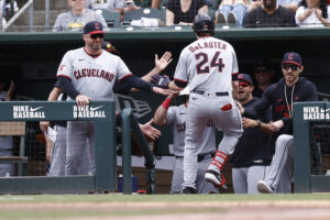 SACRAMENTO, CALIFORNIA - MAY 3: Manager Stephen Vogt #12 of the Cleveland Guardians high fives Chase DeLauter #24 after DeLauter hit a solo home run against the Athletics during the fifth inning at Sutter Health Park on May 3, 2026 in Sacramento, California.