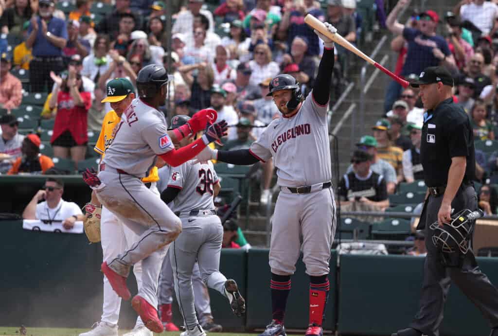 SACRAMENTO, CALIFORNIA - MAY 02: Angel Martínez #1 and Rhys Hoskins #8 of the Cleveland Guardians celebrate after Martinez scored against the Athletics in the top of the fifth inning at Sutter Health Park on May 02, 2026 in Sacramento, California.