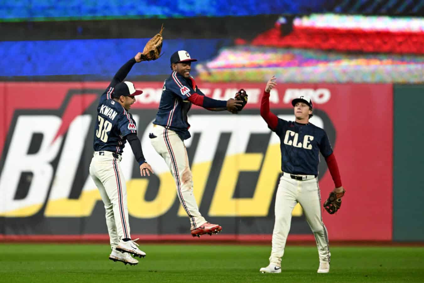 CLEVELAND, OHIO - MAY 08: (L-R) Steven Kwan #38, Angel Martínez #1 and Petey Halpin #0 of the Cleveland Guardians celebrate the team's 6-4 win over the Minnesota Twins at Progressive Field on May 08, 2026 in Cleveland, Ohio.