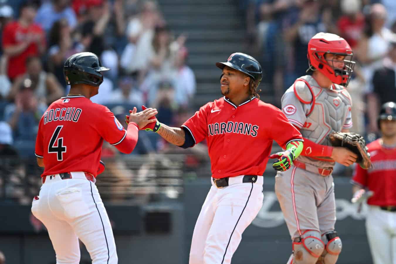 CLEVELAND, OHIO - MAY 17: Brayan Rocchio #4 and José Ramírez #11 of the Cleveland Guardians celebrate Ramirez's two-run home run during the eighth inning against the Cincinnati Reds at Progressive Field on May 17, 2026 in Cleveland, Ohio.
