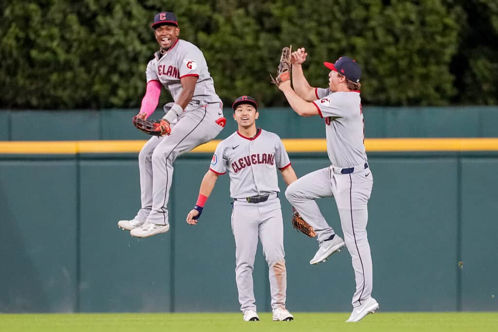 DETROIT, MICHIGAN - MAY 18: Angel Martínez #1, Steven Kwan #38 and Petey Halpin #0 of the Cleveland Guardians celebrate their win against the Detroit Tigers at Comerica Park on May 18, 2026 in Detroit, Michigan.