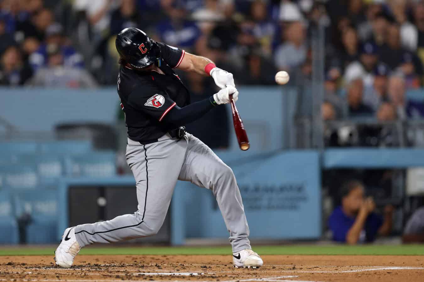 LOS ANGELES, CALIFORNIA - MARCH 30: Austin Hedges #27 of the Cleveland Guardians hits a double against the Los Angeles Dodgers during the third inning at Dodger Stadium on March 30, 2026 in Los Angeles, California