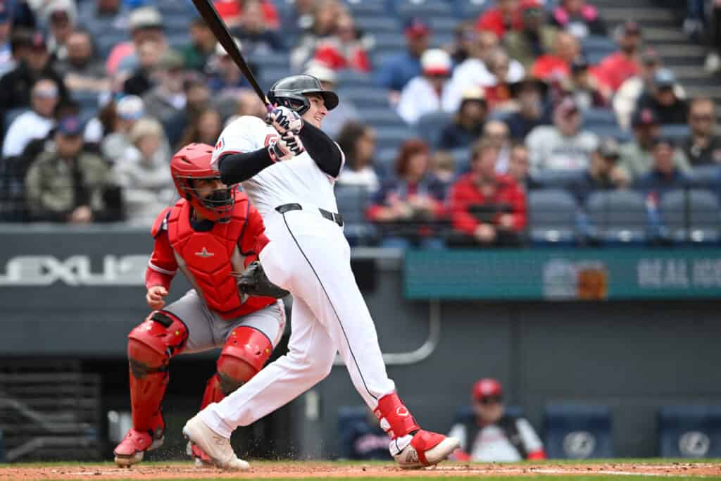 CLEVELAND, OHIO - MAY 13: Chase DeLauter #24 of the Cleveland Guardians hits an RBI sacrifice fly ball during the third inning against the Los Angeles Angels at Progressive Field on May 13, 2026 in Cleveland, Ohio.