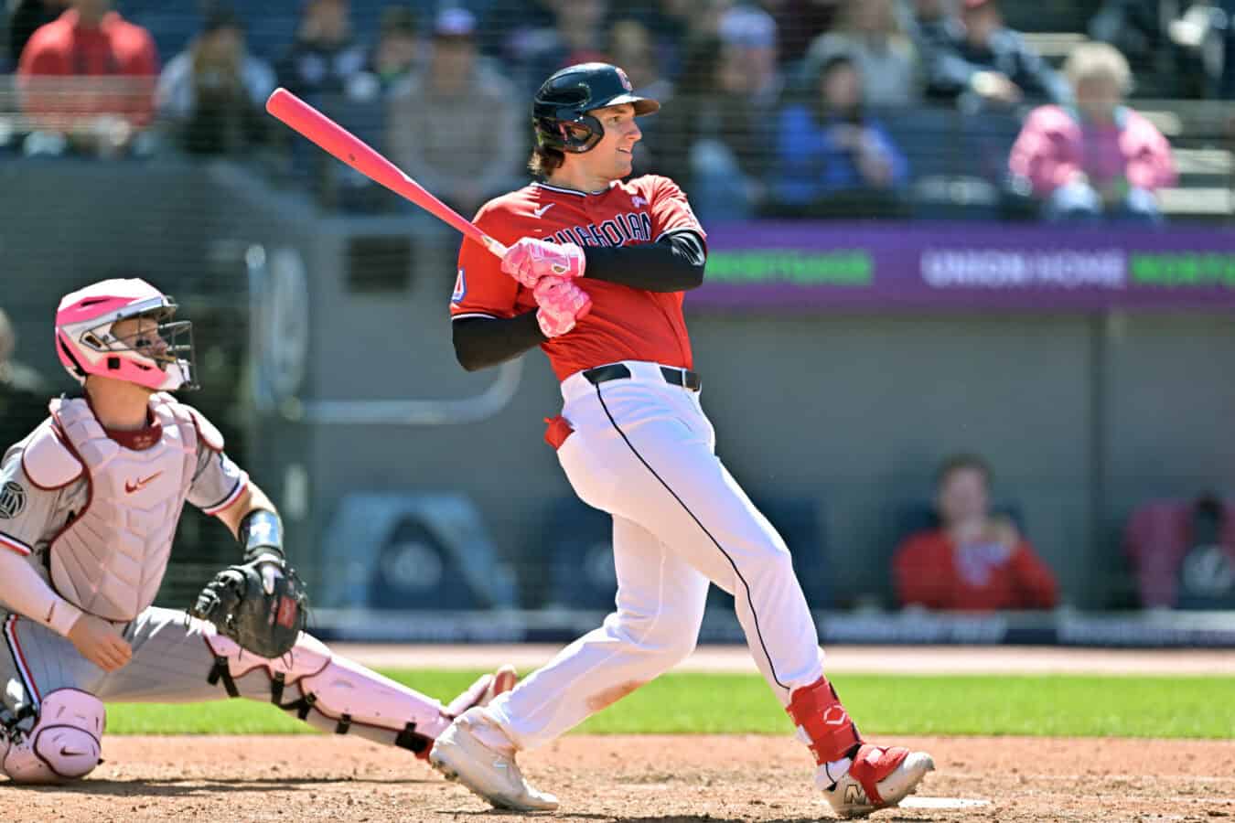 CLEVELAND, OHIO - MAY 10: Chase DeLauter #24 of the Cleveland Guardians hits an RBI single during the sixth inning against the Minnesota Twins at Progressive Field on May 10, 2026 in Cleveland, Ohio.