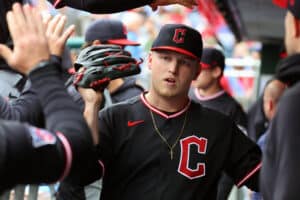 PHILADELPHIA, PENNSYLVANIA - MAY 24: Parker Messick #77 of the Cleveland Guardians high fives teammates in the dugout after finishing the fifth inning during a game against the Philadelphia Phillies at Citizens Bank Park on May 24, 2026 in Philadelphia, Pennsylvania. The Guardians won 3-1.