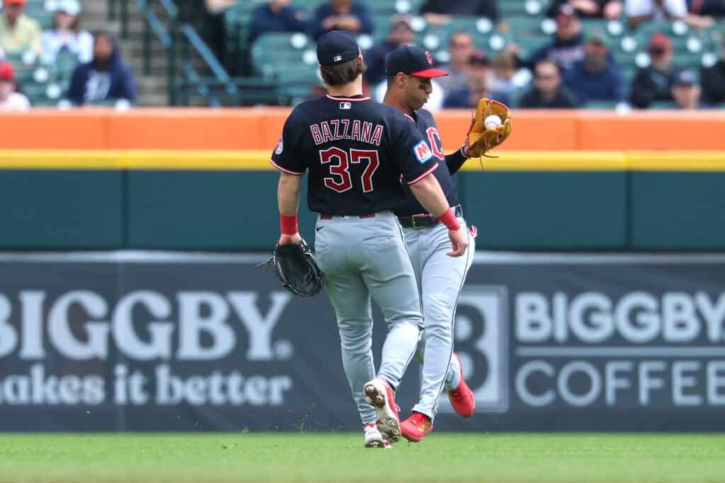 DETROIT, MICHIGAN - MAY 21: Brayan Rocchio #4 of the Cleveland Guardians catches a second inning pop fly behind Travis Bazzana #37 while playing the Detroit Tigers at Comerica Park on May 21, 2026 in Detroit, Michigan.