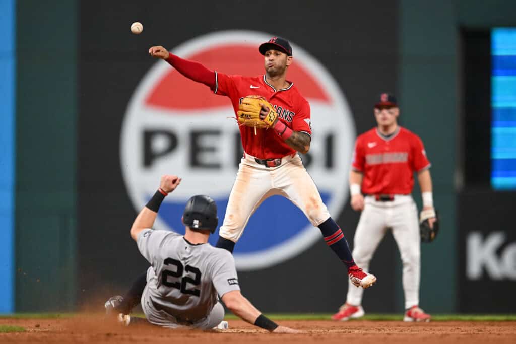 CLEVELAND, OHIO - JUNE 08: Brayan Rocchio #4 of the Cleveland Guardians throws to first base after forcing out Ben Rice #22 of the New York Yankees at second base during the eighth inning at Progressive Field on June 08, 2026 in Cleveland, Ohio.