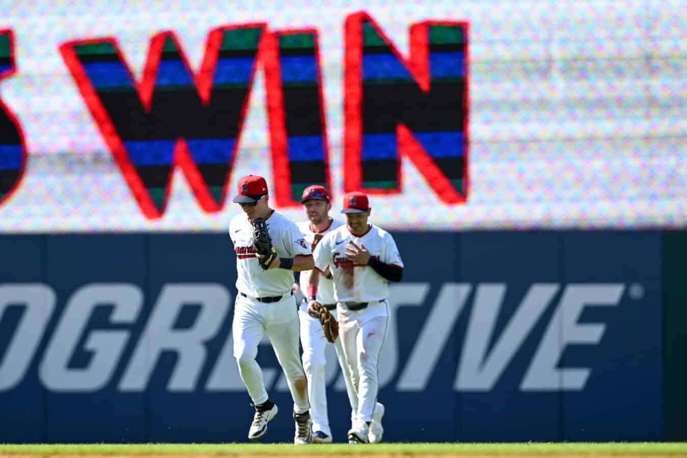 CLEVELAND, OHIO - JUNE 28: Cooper Ingle #30, Steven Kwan #38 and David Fry #6 of the Cleveland Guardians celebrate the team's 6-5 win over the Seattle Mariners at Progressive Field on June 28, 2026 in Cleveland, Ohio.