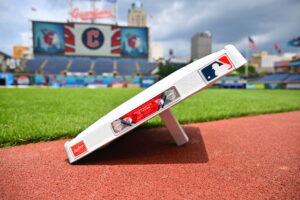 CLEVELAND, OHIO - JUNE 14: A Topps 75th Anniversary base sits near the field before the game between the Cleveland Guardians and the Detroit Tigers at Progressive Field on June 14, 2026, in Cleveland, Ohio. The game was postponed due to impending severee weather.