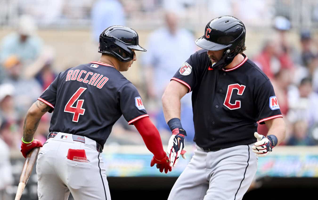 MINNEAPOLIS, MINNESOTA - JULY 7: Rhys Hoskins #8 of the Cleveland Guardians celebrates with Brayan Rocchio #4 after hitting a solo home run against the Minnesota Twins during the second inning of the game at Target Field on July 7, 2026 in Minneapolis, Minnesota.
