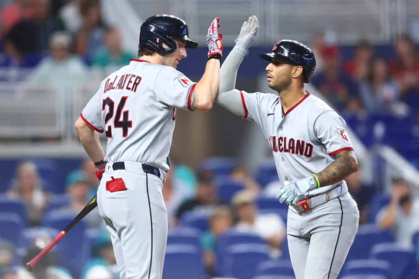 MIAMI, FLORIDA - JULY 12: Brayan Rocchio #4 of the Cleveland Guardians high fives Chase DeLauter #24 after hitting a home run against the Miami Marlins in the fifth inning of the game at loanDepot park on July 12, 2026 in Miami, Florida.