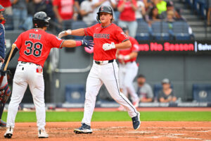 CLEVELAND, OHIO - JULY 20: Steven Kwan #38 of the Cleveland Guardians celebrates with Petey Halpin #0 after Halpin hit a two-run home run for his first major league home run during the second inning against the Minnesota Twins at Progressive Field on July 20, 2026 in Cleveland, Ohio.