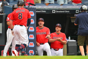 CLEVELAND, OHIO - JULY 20: Rhys Hoskins #8 of the Cleveland Guardians celebrates with manager Stephen Vogt during the third inning against the Minnesota Twins at Progressive Field on July 20, 2026 in Cleveland, Ohio.