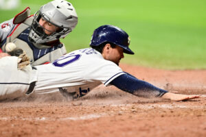 ST PETERSBURG, FLORIDA - JULY 24: Nick Fortes #40 of the Tampa Bay Rays slides home to score on an error by Austin Hedges #27 of the Cleveland Guardians in the sixth inning at Tropicana Field on July 24, 2026 in St Petersburg, Florida.