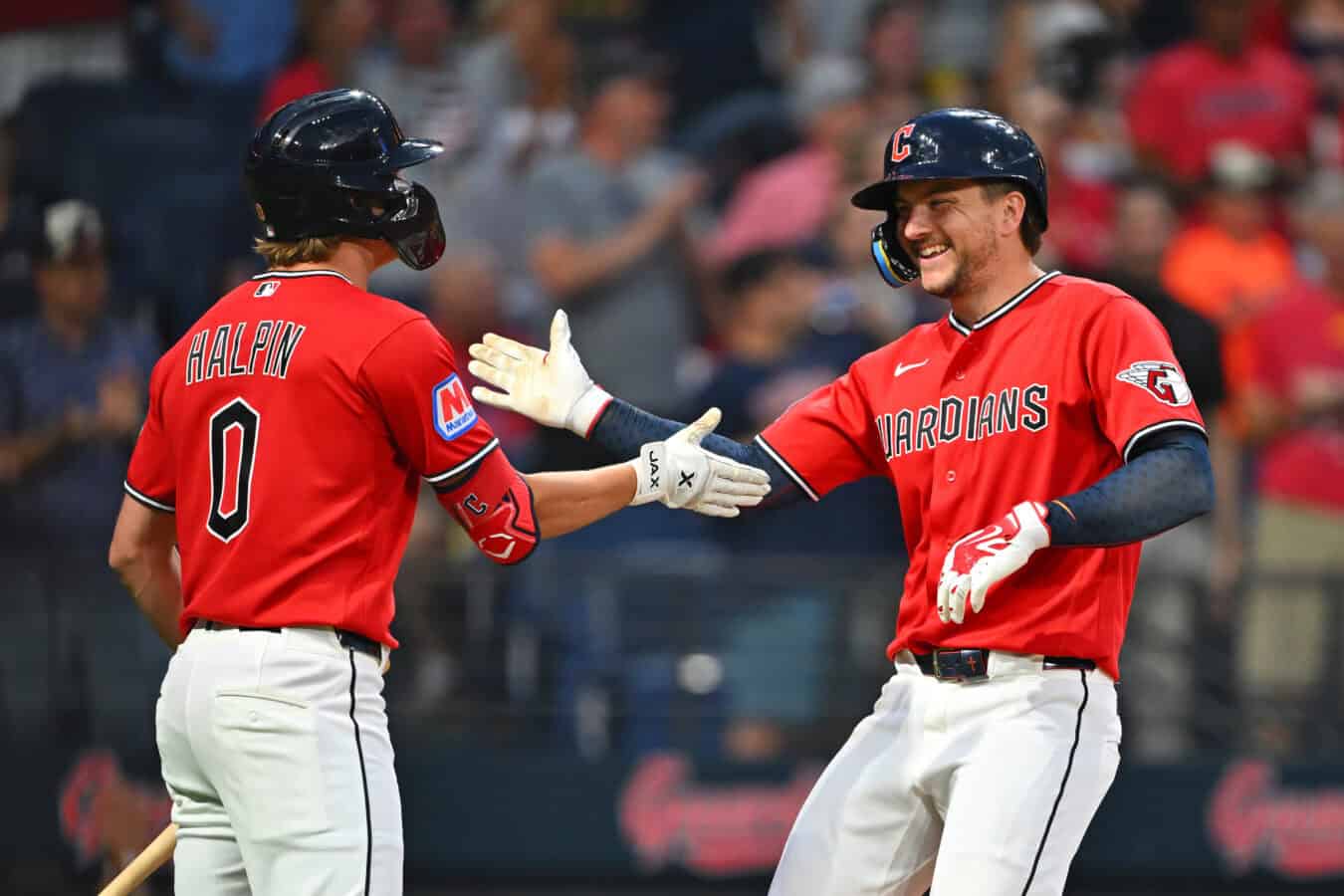 CLEVELAND, OHIO - JULY 20: Petey Halpin #0 of the Cleveland Guardians celebrates with Patrick Bailey #16 of the Cleveland Guardians after Bailey hit a solo home run during the seventh inning against the Minnesota Twins at Progressive Field on July 20, 2026 in Cleveland, Ohio.