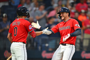 CLEVELAND, OHIO - JULY 20: Petey Halpin #0 of the Cleveland Guardians celebrates with Patrick Bailey #16 of the Cleveland Guardians after Bailey hit a solo home run during the seventh inning against the Minnesota Twins at Progressive Field on July 20, 2026 in Cleveland, Ohio.
