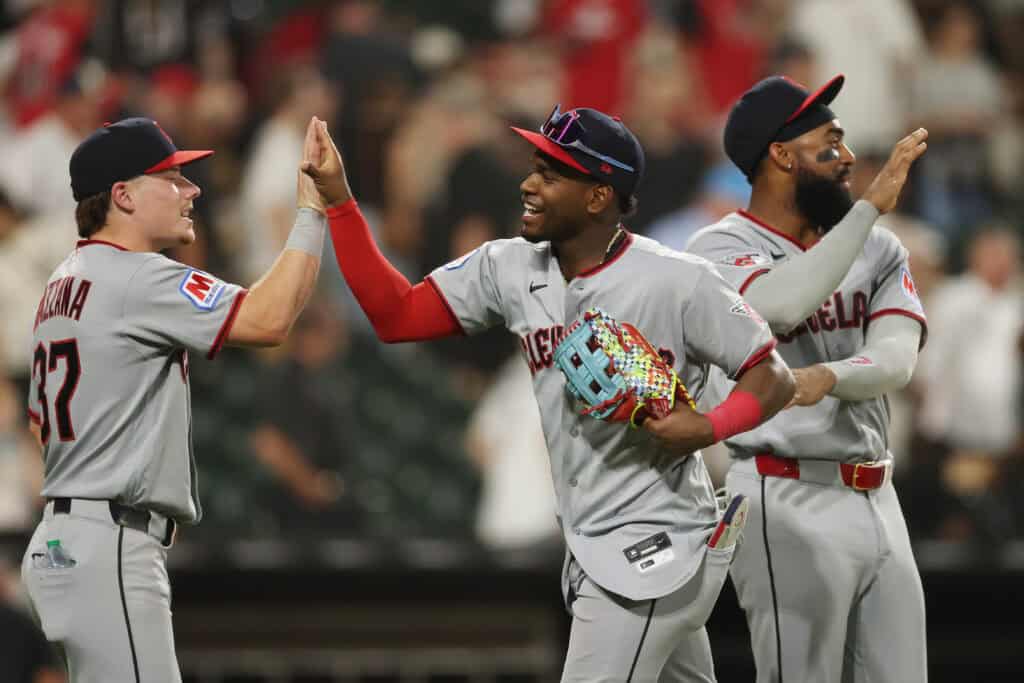 CHICAGO, ILLINOIS - AUGUST 07: Travis Bazzana #37, Angel MartÃnez #1 and Jo Adell #7 of the Cleveland Guardians celebrate after defeating the Chicago White Sox at Rate Field on August 07, 2026 in Chicago, Illinois.