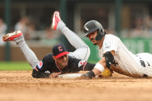 CHICAGO, ILLINOIS - AUGUST 09: Miguel Vargas #20 of the Chicago White Sox reaches second base on a double past the tag of Brayan Rocchio #4 of the Cleveland Guardians during the first inning at Rate Field on August 09, 2026 in Chicago, Illinois. (