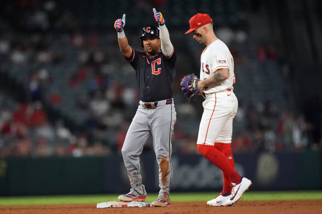 ANAHEIM, CALIFORNIA - AUGUST 25: Jose Ramirez #11 of the Cleveland Guardians celebrates his two-run double as Zach Neto #9 of the Los Angeles Angels looks on during the fourth inning at Angel Stadium of Anaheim on August 25, 2026 in Anaheim, California.