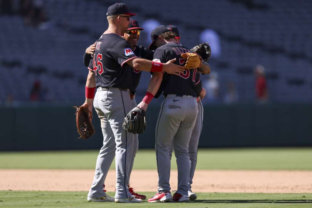 ANAHEIM, CALIFORNIA - AUGUST 26: Nathaniel Lowe #46, Angel Genao #17, Travis Bazzana #37 and Brayan Rocchio #4 of the Cleveland Guardians celebrate a 4-3 win over the Los Angeles Angels at Angel Stadium of Anaheim on August 26, 2026 in Anaheim, California.