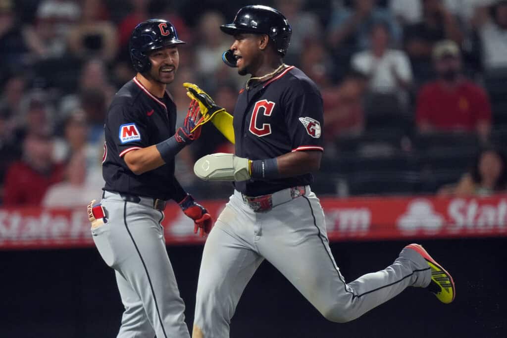 ANAHEIM, CALIFORNIA - AUGUST 25: Angel Martinez #1 of the Cleveland Guardians celebrates scoring on a single off the bat of Brayan Rocchio with Steven Kwan #38 in the fifth inning against the Los Angeles Angels at Angel Stadium of Anaheim on August 25, 2026 in Anaheim, California.