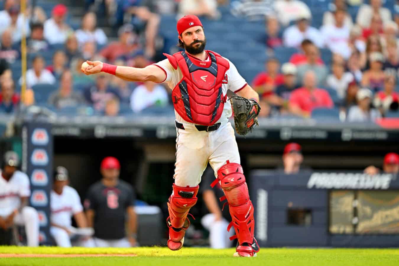 CLEVELAND, OHIO - AUGUST 16: Catcher Austin Hedges #27 of the Cleveland Guardians throws out Jake Cronenworth #9 of the San Diego Padres at first base during the fifth inning at Progressive Field on August 16, 2026 in Cleveland, Ohio