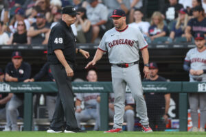 CHICAGO, ILLINOIS - AUGUST 07: Manager Stephen Vogt #12 of the Cleveland Guardians talks with umpire Andy Fletcher #49 during the first inning against the Chicago White Sox at Rate Field on August 07, 2026 in Chicago, Illinois.