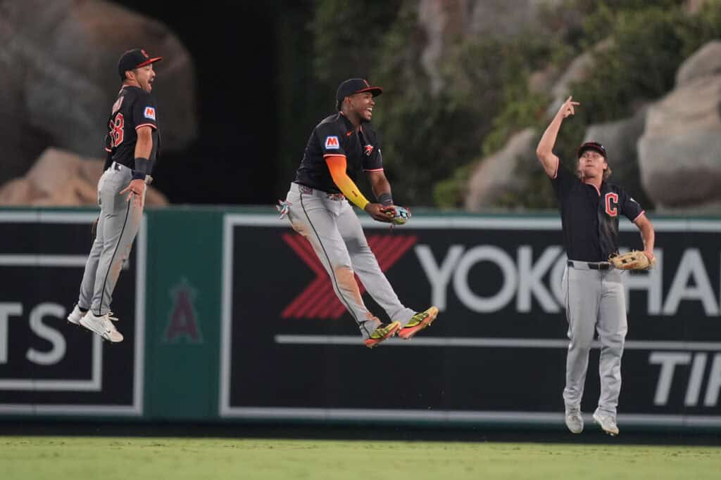 ANAHEIM, CALIFORNIA - AUGUST 24: Stephen Kwan #38, Angel Martinez #1 and Petey Halpin #0 of the Cleveland Guardians celebrate 4-2 win over the Los Angeles Angels at Angel Stadium of Anaheim on August 24, 2026 in Anaheim, California.