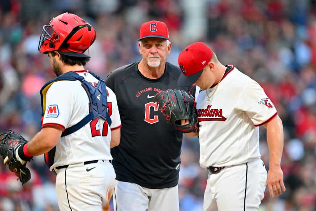 CLEVELAND, OHIO - SEPTEMBER 05: Catcher Austin Hedges #27 and pitching coach Carl Willis #51of the Cleveland Guardians visit the mound to talk to starting pitcher Parker Messick #77 of the Cleveland Guardians during the sixth inning against the Detroit Tigers at Progressive Field on September 05, 2026, in Cleveland, Ohio.