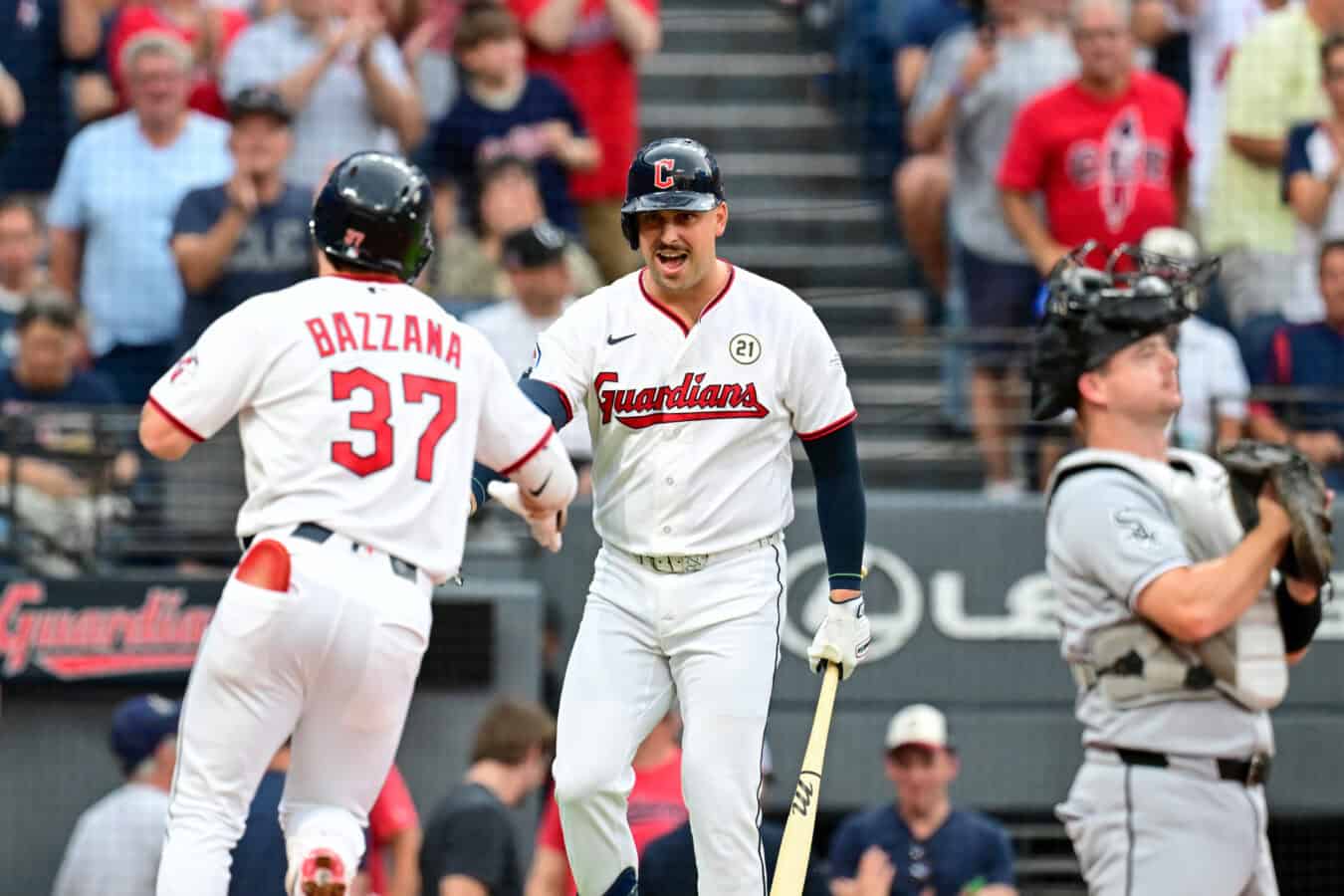 CLEVELAND, OHIO - SEPTEMBER 15: Travis Bazzana #37 and Nathaniel Lowe #46 of the Cleveland Guardians celebrate a solo home run hit by Bazzana during the first inning against the Chicago White Sox at Progressive Field on September 15, 2026 in Cleveland, Ohio. (Photo by Nick