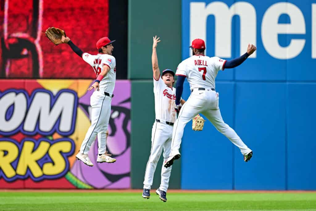 CLEVELAND, OHIO - SEPTEMBER 16: Steven Kwan #38, Petey Halpin #0 and Jo Adell #7 of the Cleveland Guardians celebrate the team's 6-3 win over the Chicago White Sox at Progressive Field on September 16, 2026 in Cleveland, Ohio.