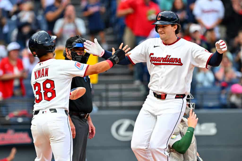 CLEVELAND, OHIO - SEPTEMBER 19: Steven Kwan #38 celebrates with Chase DeLauter #24 of the Cleveland Guardians after both scored on a three-run homer by DeLauter during the first inning against the Athletics at Progressive Field on September 19, 2026, in Cleveland, Ohio.