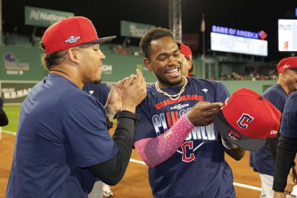 BOSTON, MASSACHUSETTS - SEPTEMBER 24: Jose Ramirez #11 and Angel Martinez #1 of the Cleveland Guardians celebrate the win over the of the Boston Red Sox at Fenway Park on September 24, 2026 in Boston, Massachusetts. The Cleveland Guardians secured a spot in the 2026 playoffs with the win over the Boston Red Sox.