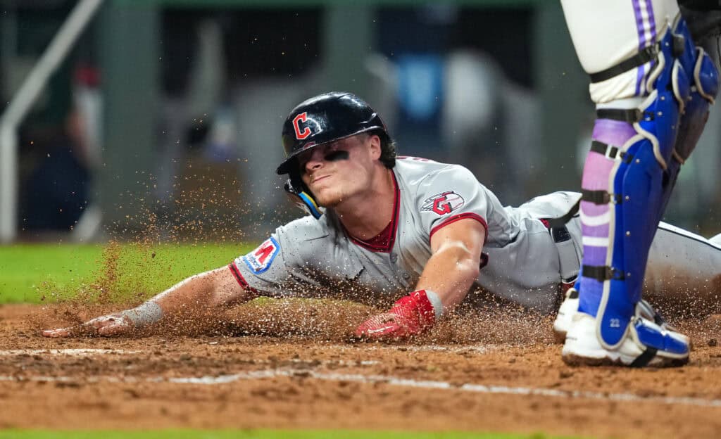 KANSAS CITY, MISSOURI - SEPTEMBER 25: Travis Bazzana #37 of the Cleveland Guardians slides into home to score a run during the fifth inning against the Kansas City Royals at Kauffman Stadium on September 25, 2026 in Kansas City, Missouri.