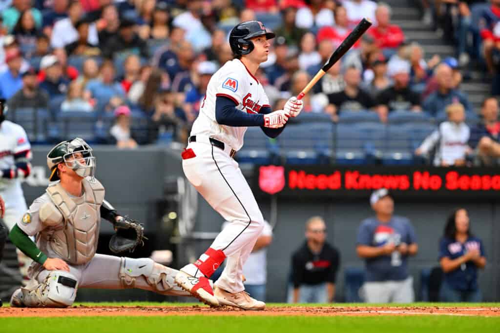 CLEVELAND, OHIO - SEPTEMBER 19: Chase DeLauter #24 of the Cleveland Guardians hits a three-run homer during the first inning against the Athletics at Progressive Field on September 19, 2026 in Cleveland, Ohio.