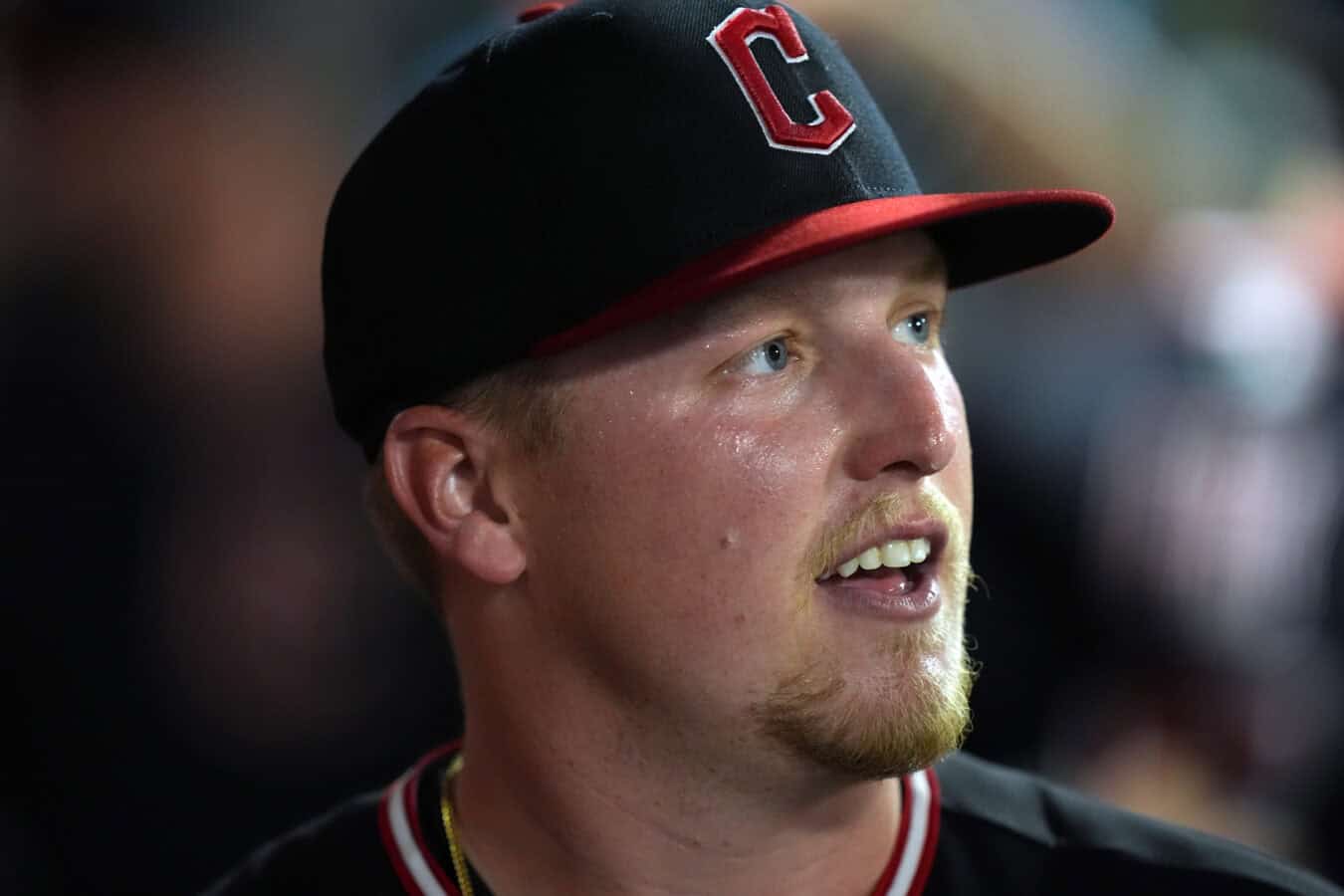 ANAHEIM, CALIFORNIA - AUGUST 24: Pitcher Parker Messick #77 of the Cleveland Guardians smiles in the dugout after retiring the Los Angeles Angels during the sixth inning of a game at Angel Stadium of Anaheim on August 24, 2026 in Anaheim, California.