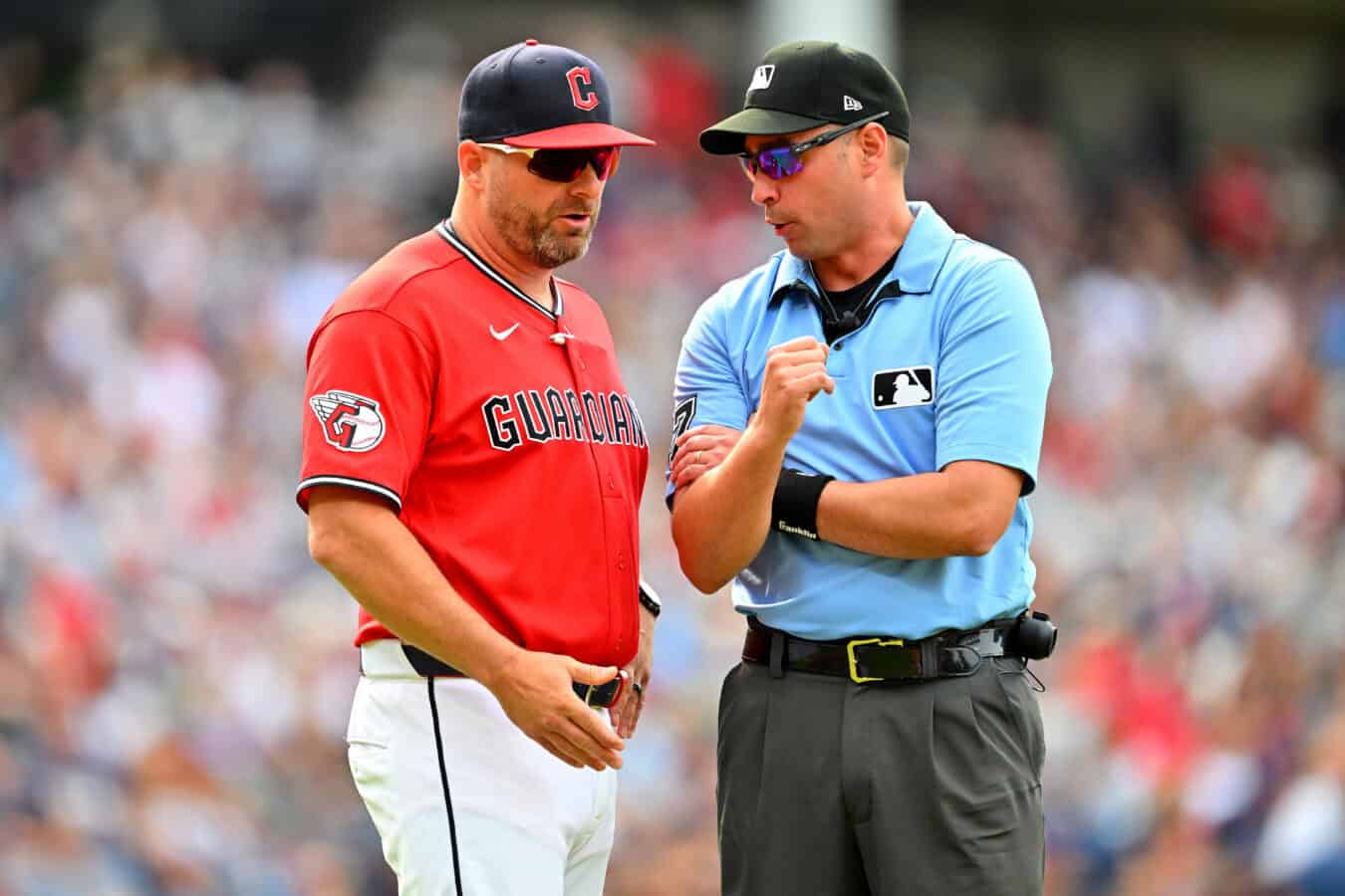 CLEVELAND, OHIO - AUGUST 29: Manager Stephen Vogt of the Cleveland Guardians talks to first base umpire Paul Clemons #57 during the third inning against the Kansas City Royals at Progressive Field on August 29, 2026, in Cleveland, Ohio.