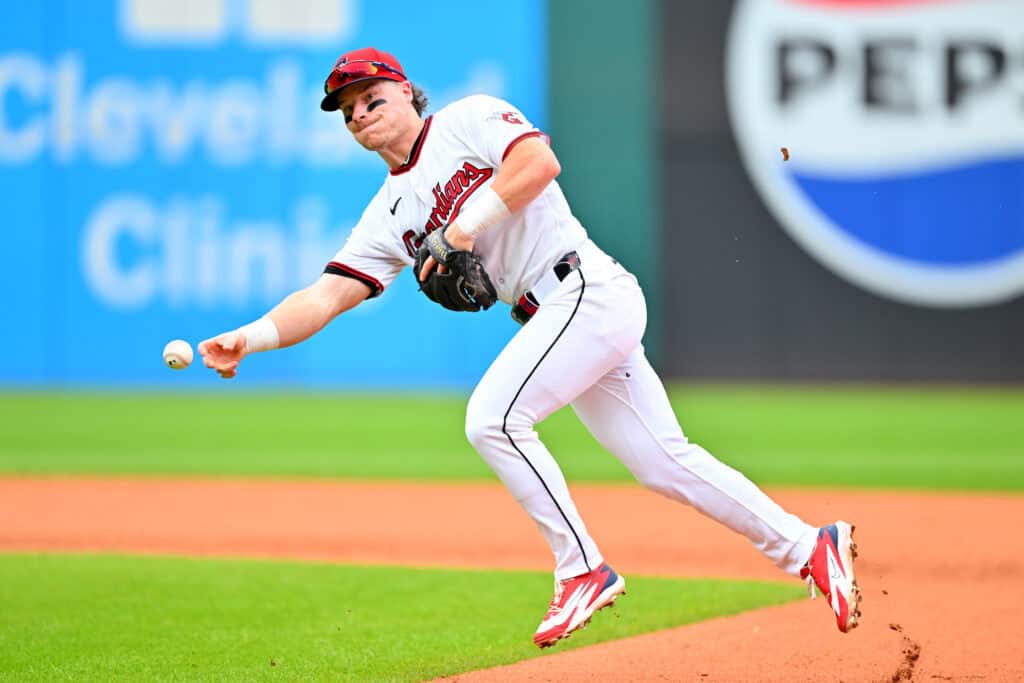 CLEVELAND, OHIO - AUGUST 30: Second baseman Travis Bazzana #37 of the Cleveland Guardians throws out Jac Caglianone #14 of the Kansas City Royals at first to end the top of the seventh inning at Progressive Field on August 30, 2026 in Cleveland, Ohio.