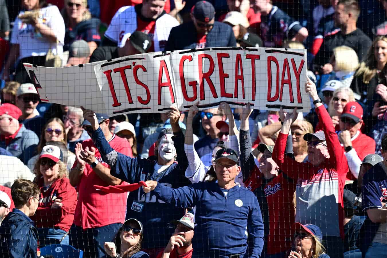 CLEVELAND, OHIO - OCTOBER 03: Fans of the Cleveland Guardians hold up a sign during the fifth inning against the Chicago White Sox in game one of the American League Division Series at Progressive Field on October 03, 2026 in Cleveland, Ohio.