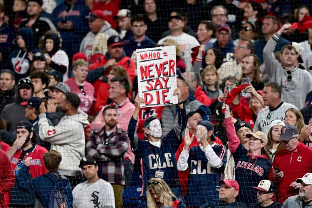 CLEVELAND, OHIO - OCTOBER 05: A fan holds a sign during the ninth inning in game two of the American League Division Series between the Chicago White Sox and the Cleveland Guardians at Progressive Field on October 05, 2026 in Cleveland, Ohio.