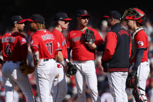 CLEVELAND, OHIO - OCTOBER 15: Manager Stephen Vogt of the Cleveland Guardians meets with the team during a pitching change in the eighth inning against the Tampa Bay Rays in game three of the American League Championship Series at Progressive Field on October 15, 2026 in Cleveland, Ohio.