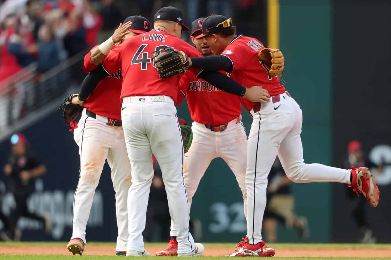 CLEVELAND, OHIO - OCTOBER 15: José Ramírez #11, Nathaniel Lowe #46, Brayan Rocchio #4, and Angel Genao #17 of the Cleveland Guardians celebrate after defeating the Tampa Bay Rays 3-2 in game three of the American League Championship Series at Progressive Field on October 15, 2026 in Cleveland, Ohio.