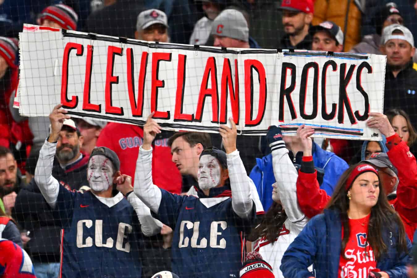 CLEVELAND, OHIO - OCTOBER 17: Fans of the Cleveland Guardians show their support by holding signs from the stands during the fifth inning against the Tampa Bay Rays in game four of the American League Championship Series at Progressive Field on October 17, 2026 in Cleveland, Ohio.