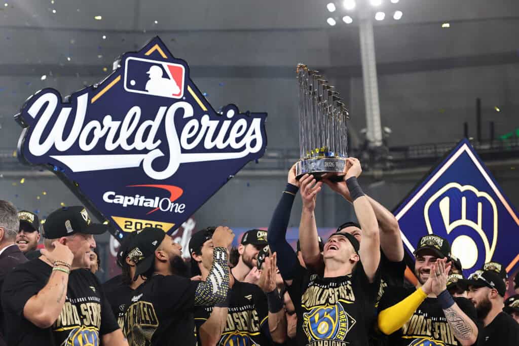 ST PETERSBURG, FLORIDA - OCTOBER 28: Cooper Pratt #12 of the Milwaukee Brewers poses with the Commissioner's Trophy after defeating the Tampa Bay Rays in the 2026 World Series at Tropicana Field on October 28, 2026 in St Petersburg, Florida.