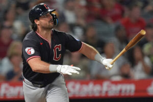 ANAHEIM, CALIFORNIA - AUGUST 24: Austin Hedges #27 of the Cleveland Guardians watches his 2-run home run against the Los Angeles Angels during the sixth inning of a game at Angel Stadium of Anaheim on August 24, 2026 in Anaheim, California.