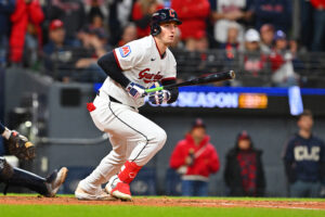 CLEVELAND, OHIO - OCTOBER 18: Chase DeLauter #24 of the Cleveland Guardians hits an RBI fielder's choice during the sixth inning against the Tampa Bay Rays in game five of the American League Championship Series at Progressive Field on October 18, 2026 in Cleveland, Ohio.