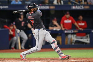 ST PETERSBURG, FLORIDA - OCTOBER 19: Jo Adell #7 of the Cleveland Guardians hits a double during the fourth inning against the Tampa Bay Rays in game six of the American League Championship Series at Tropicana Field on October 19, 2026 in St Petersburg, Florida.