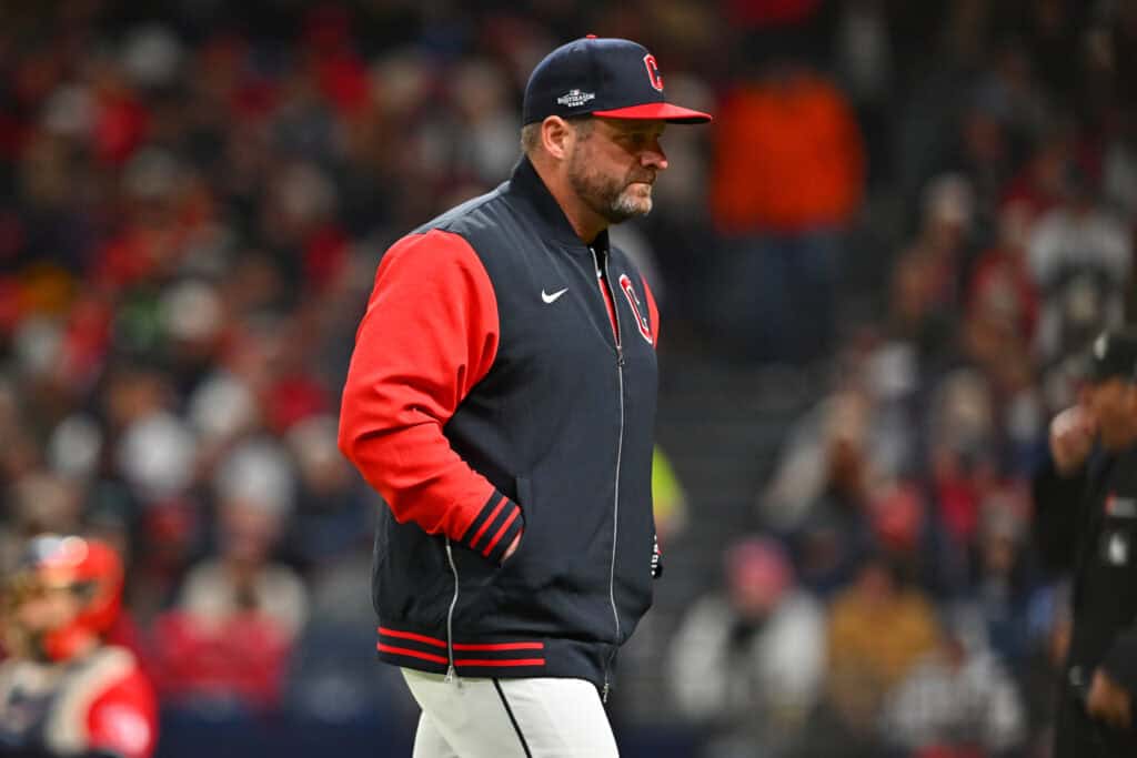 CLEVELAND, OHIO - OCTOBER 17: Manager Stephen Vogt #12 of the Cleveland Guardians walks to the dugout during the seventh inning against the Tampa Bay Rays in game four of the American League Championship Series at Progressive Field on October 17, 2026 in Cleveland, Ohio.